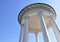 Gazebo with white columns against the sky