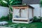 Gazebo with a wooden bed under a mosquito grid on a outside