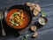 Gazpacho soup with spicy fried chickpeas on a dark background. Vegetarian healthy food diet weight loss