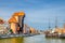 Gdansk cityscape with Zuraw Crane building and typical colorful houses at Long Bridge embankment promenade