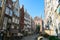 Gdansk - A deserted street in Old Town of Gdansk, Poland. The both sides of a paved alley have tall medieval buildings