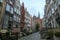 Gdansk - A deserted street in Old Town of Gdansk, Poland. The both sides of a paved alley have tall medieval buildings