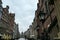 Gdansk - A deserted street in Old Town of Gdansk, Poland. The both sides of a paved alley have tall medieval buildings