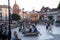 Gdansk, North Poland - August 13, 2020: People doing leisure at city center opposite Carousel horses at the old town over Motlawa