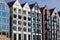 Gdansk, North Poland - August 14, 2020: Close up shot of bunch of various colorful building exterior with motlawa river reflection