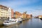 Gdansk, Poland, April 15, 2018: White tourist boat ship on Motlawa river water, typical colorful houses buildings