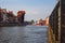 Gdansk Poland. Historical brick colorful building, old crane.  red roofs and Baltic sea canal, yachts. Sunny day, spring time.