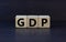 GDP, good distribution practice symbol. Concept words `GDP, good distribution practice` on cubes on a beautiful grey background.