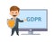 GDPR protector. Funny cartoon character with a shield in front of the screen showing GDPR letters. Flat vector