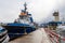 Gdynia, pomorskie / Poland-September, 17,2019: Tugs moored at the port quay. View of the port buildings in Central Europe