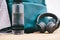 Gear up, its game time. a sports bag and other items in an empty squash court.