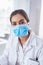 She is geared up and ready for science. Portrait of a confident young female scientist wearing a surgical mask while