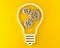 Gears cogwheels in lightbulb shape over yellow background - strategy, creative or business innovation modern minimal concept