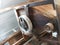 Gears and pulleys in an old wooden watermill used for grinding f