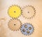 Gears wooden yellow brown gray connected with each other. Toys