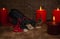 Gebo rune, a bag of runes, and a background of candles with selective focus.