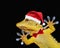 Gecko with santa claus hat and bow tie that greets everyone