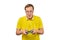 Geek gamer in glasses and yellow T-shirt with gamepad, excited video game player isolated on white