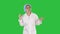 Geek young blonde doctor woman talking to camera on a Green Screen, Chroma Key.