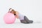 Geeky hipster resting on fitness ball