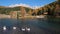 Geese flock on autumn mountain pond, not far from San Pellegrino Pass, Dolomites, Italy