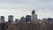 Geese Flying over Denver Skyline