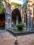 Geeses in the courtyard of the cloister of the Cathedral at sunset