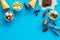 Gelato, waffle cone, berries, chocolate on blue background top view copyspace