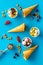 Gelato, waffle cone, berries, chocolate, hazelnut on blue background top view copyspace