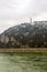 gellert mountain with a river don at the foot of a forest covered road to the fort and a statue of freedom historical complex.