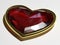 Gem in form a heart in a gold frame