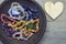 Gem stones and crystals on a wooden background with cairn pebbles