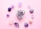 Gemstone minerals on a pink background. Round tumbling minerals of amethyst, rose quartz, apatite, turquoise, agate