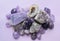 Gemstone minerals on a white background. Round tumbling minerals of amethyst and amethyst crystal
