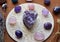 Gemstones for zodiac signs, amethysts and rose quartz on the zodiac chart. Predictions, witchcraft, spiritual esoteric practice