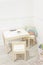 Gender-neutral decoration in children room corner. Scandinavian stylish unisex kids furniture