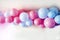 gender reveal party blue and pink balloons in living room on white wall definition of a boy or girl, gathering party party