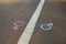 Gender symbols or signs for male and female drawn with chalk on asphalt. The concept of gender equality