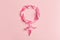Gender Venus symbol made of beautiful flower petals on candy pink background