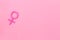 Gender Venus symbol made of contraceptive pills - woman health concept - on pink background top-down copy space