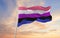 Genderfluidity Pride-flag waving in the wind at cloudy sky. Freedom and love concept. Pride month. activism, community and freedom