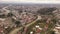 General aerial view of Kutaisi cityscape on banks of Rioni River in springtime, Imereti region, Georgia