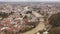 General aerial view of Kutaisi cityscape on banks of Rioni River in springtime, Imereti region, Georgia