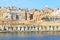 General view of ancient Valletta waterfront with Victoria Gate from water point