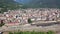 General view of Domodossola city at foot of green Italian Alps in sunny summer day looking out over railway station