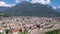 General view of Domodossola city at foot of green Italian Alps in sunny summer day looking out over railway station