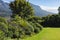 General view of garden with stunning mountains countryside on sunny day