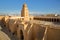 General view of the Great Mosque of Kairouan viewed from outside, with the minaret and the courtyard