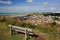 General view of Hastings old town from East Hill with a wooden bench in the foreground, Hastings, UK