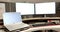 General view of laptop and computers with blank screens in office, slow motion